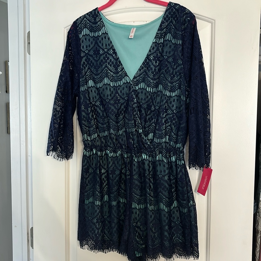 Women’s lace romper. Front closure and sheer sleeves